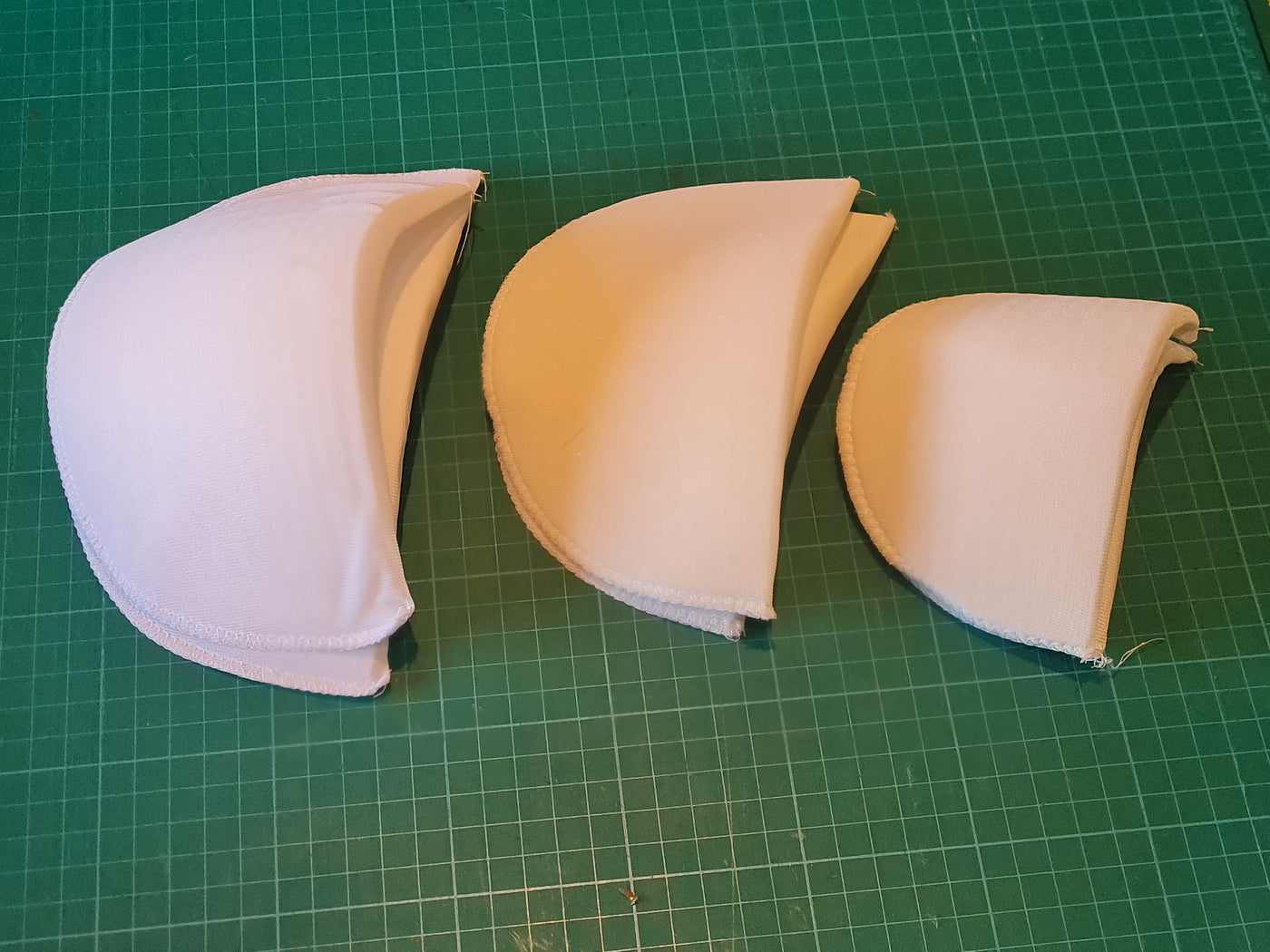 Shoulder Pads (one pair), white small, medium and large. Dressmaking and sewing.