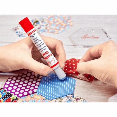 Sew Easy Basting Glue non-toxic fabric glue pen. Washes out.